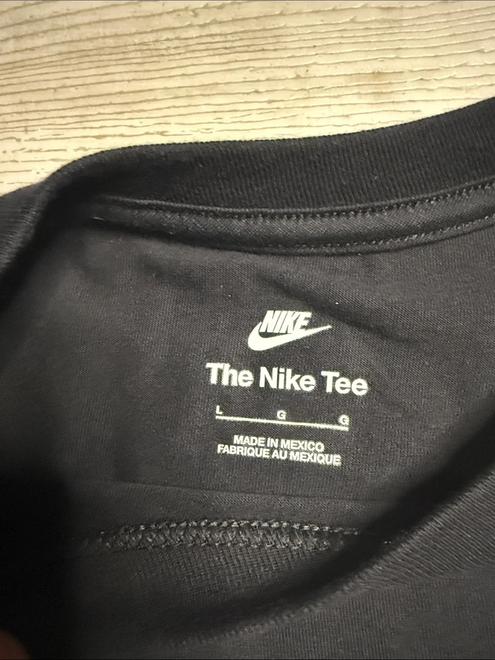 Nike Black Graphic Tee with White Print and Purple Logo Accent